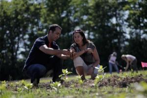Prof and Student, Farm Manager and Project Coordinator tending the fields.
